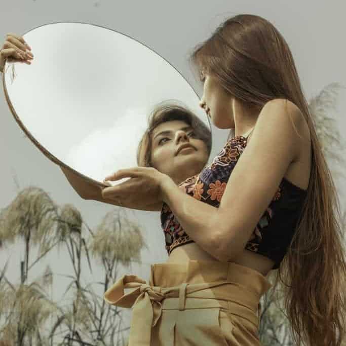 Woman Holding a Mirror